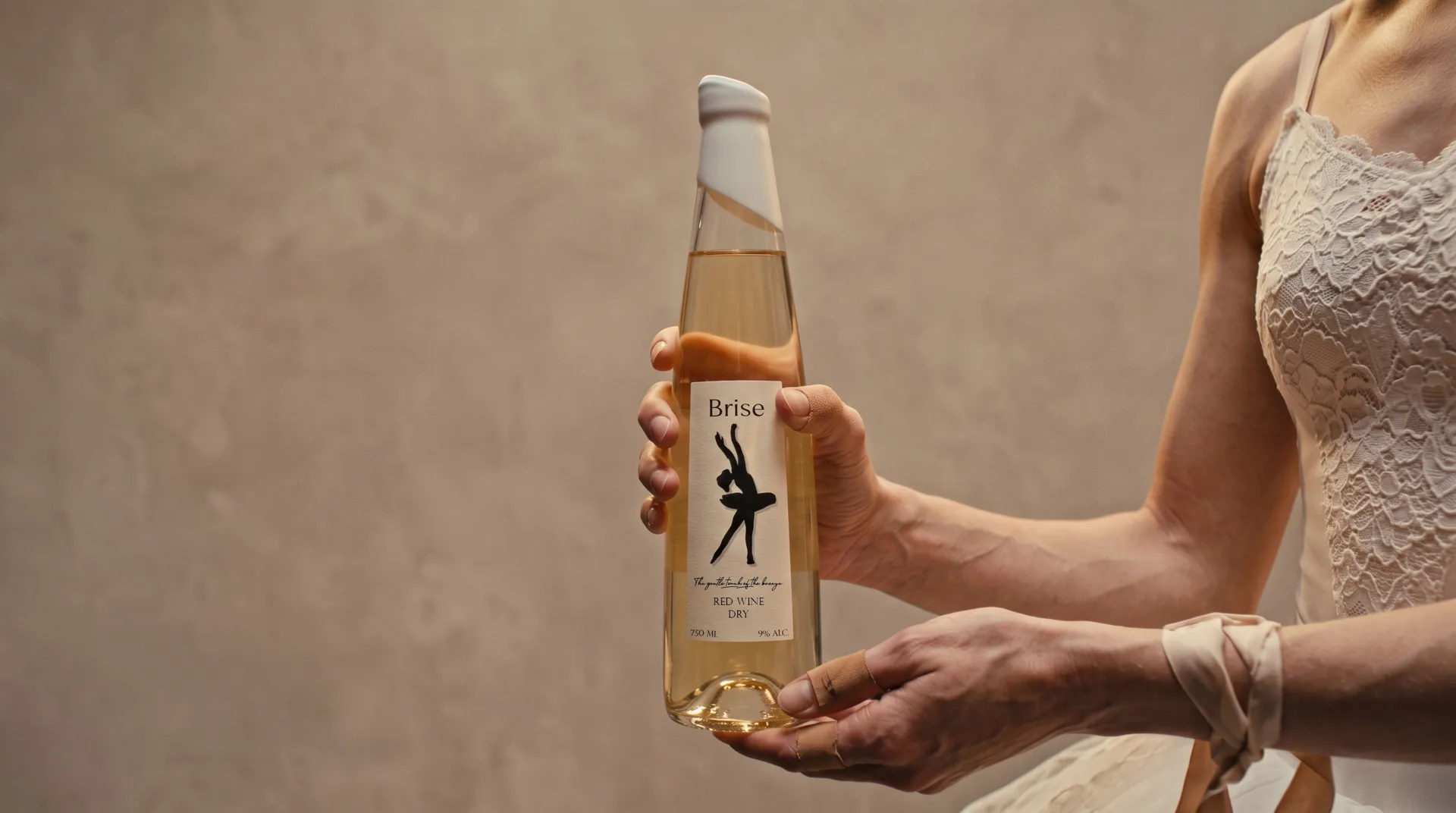 A dancer holding the white wine